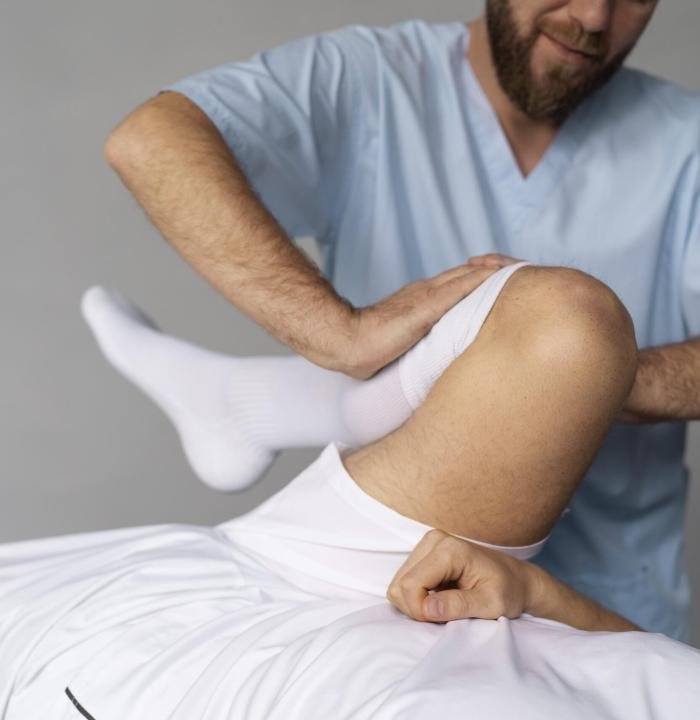 physiotherapist-helping-patient-front-view-min physiotherapist-helping-patient-front-view-min